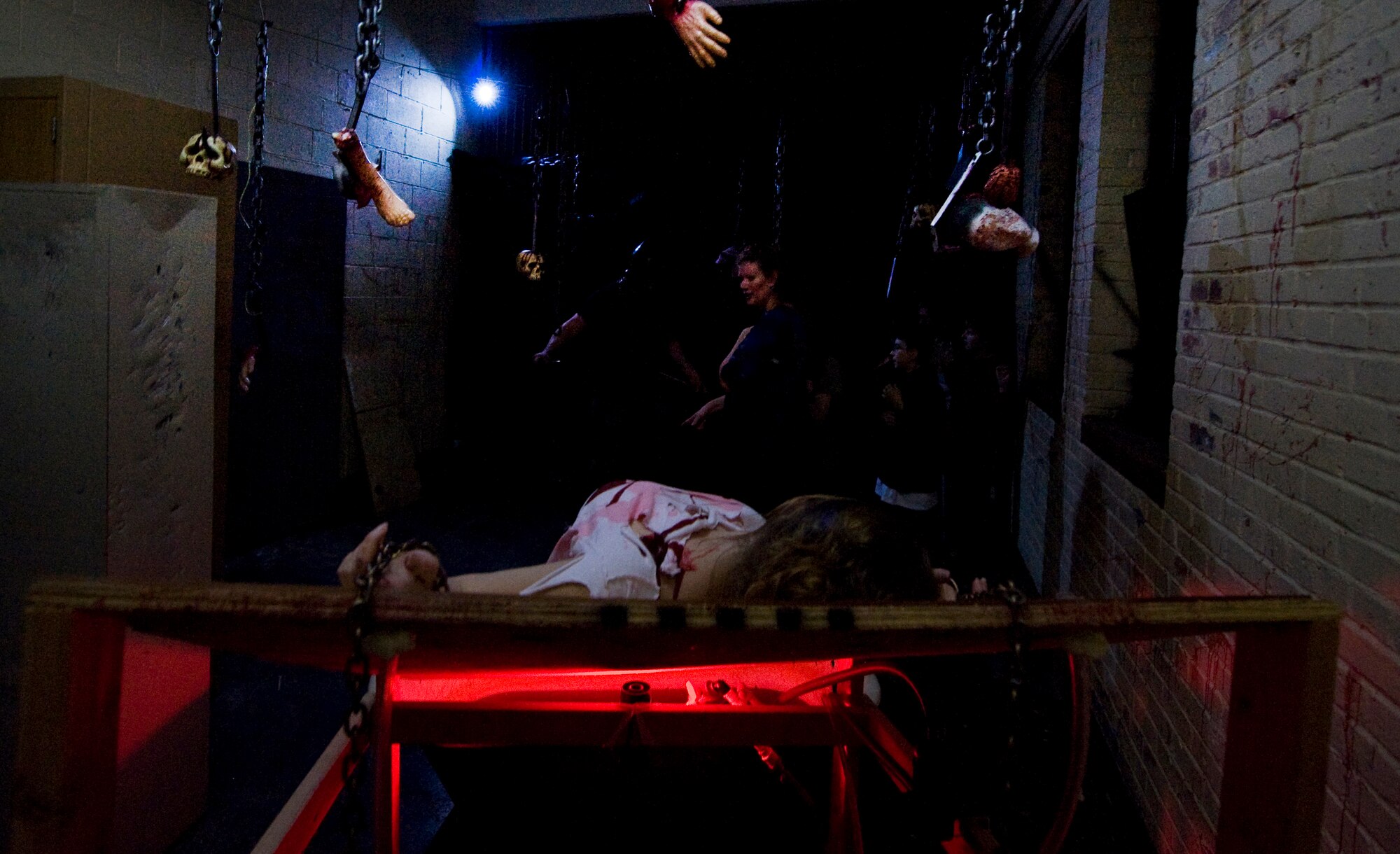 Team Barksdale members cautiously walk through a room at the 2nd Civil Engineer Squadron's haunted house on Barksdale Air Force Base, La., Oct. 29, 2013. The cost of the haunted house, is $10. It runs through Halloween night and is open from 7 p.m. to 11 p.m. (U.S. Air Force photo/Senior Airman Sean)
