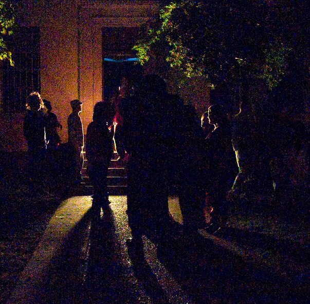 Team Barksdale members prepare to enter the 2nd Civil Engineer Squadron's haunted house on Barksdale Air Force Base, La., Oct. 29, 2013. More than 10 years running, the haunted house is filled with spooky surprises, hand-made special effects and a cast of volunteers dressed as zombies, prisoners, clowns and horror movie characters. (U.S. Air Force photo/Senior Airman Sean Martin)
