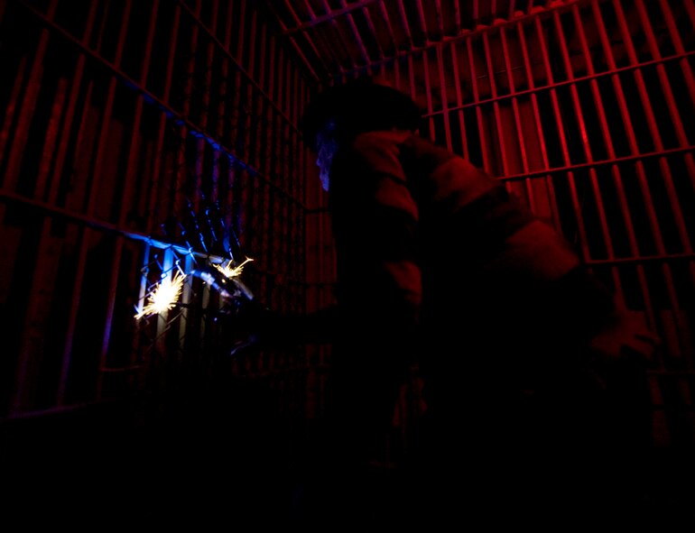 An Airman dressed as Freddy Krueger scares unsuspecting patrons at the 2nd Civil Engineer Squadron's haunted house on Barksdale Air Force Base, La., Oct. 29, 2013. The haunted house, which runs through Halloween night, has attracted hundreds of visitors this year alone. (U.S. Air Force photo/Senior Airman Sean Martin)
