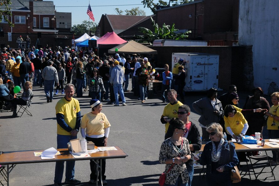 Community members gather to taste and vote for their favorite chili during the Really Chili challenge in Goldsboro, N.C., Oct. 26, 2013. The event featured various dishes including fried chicken, vegetarian and beer-based chilies. (U.S. Air Force photo by Airman 1st Class Aaron J. Jenne/Released)