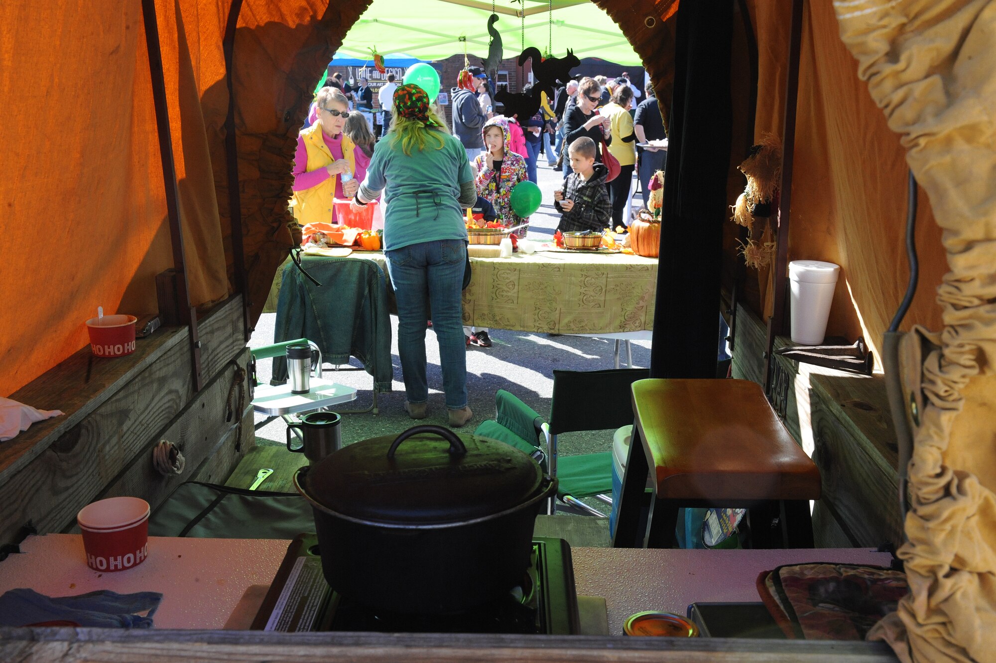 A contestant serves chili during the Really Chili Challenge in Goldsboro, N.C., Oct. 26, 2013. Several teams entered the contest with decorated booths at this year’s event. (U.S. Air Force photo by Airman 1st Class Aaron J. Jenne/Released)
