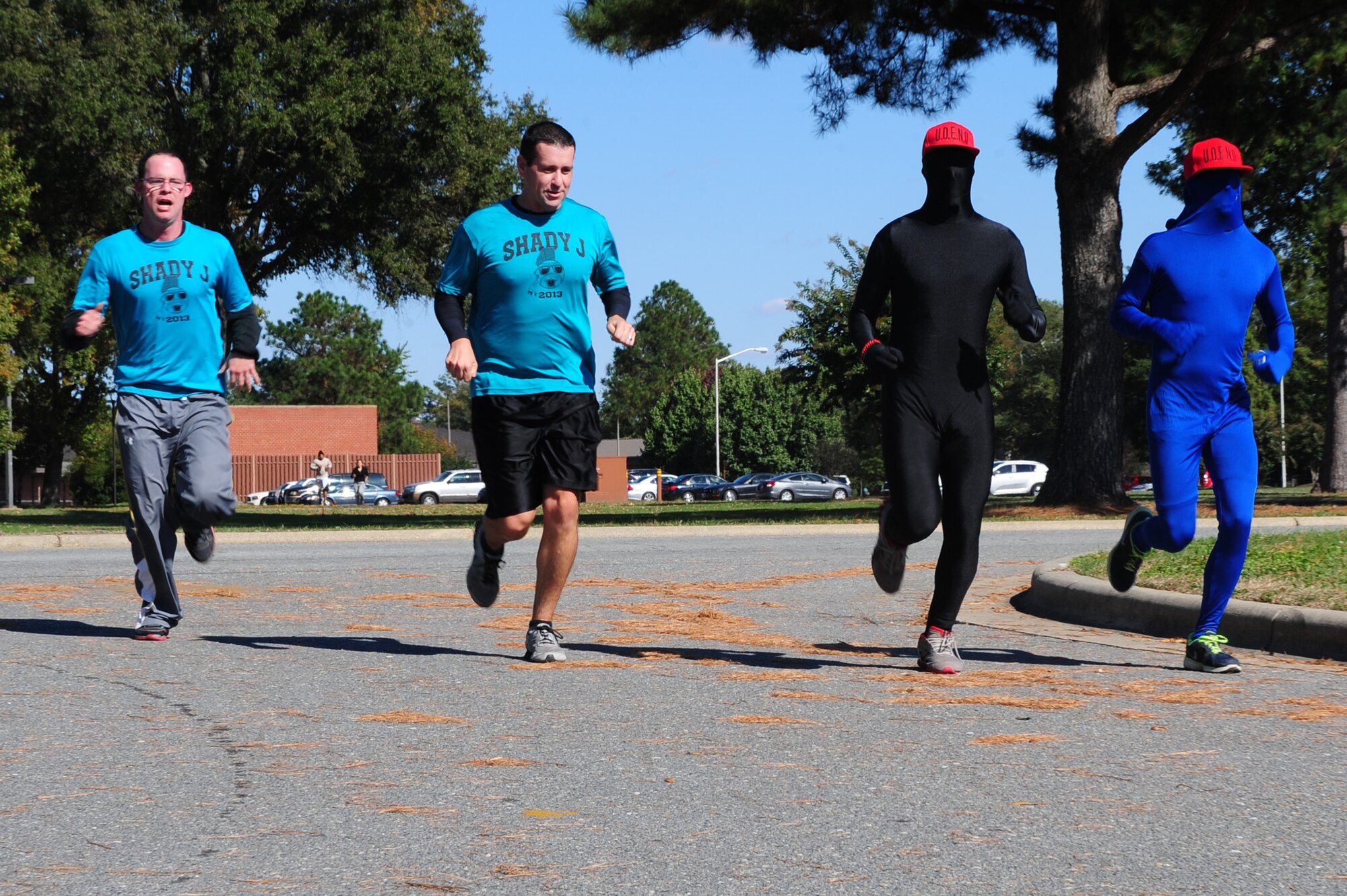 Competitors sprint toward the next objective during the Community Quest Game of Discovery at Seymour Johnson Air Force Base, N.C., Oct. 25, 2013. The base-wide scavenger hunt pitted two-man teams against each other as they competed in physical and mental challenges. (U.S. Air Force photo by Airman 1st Class John Nieves Camacho)