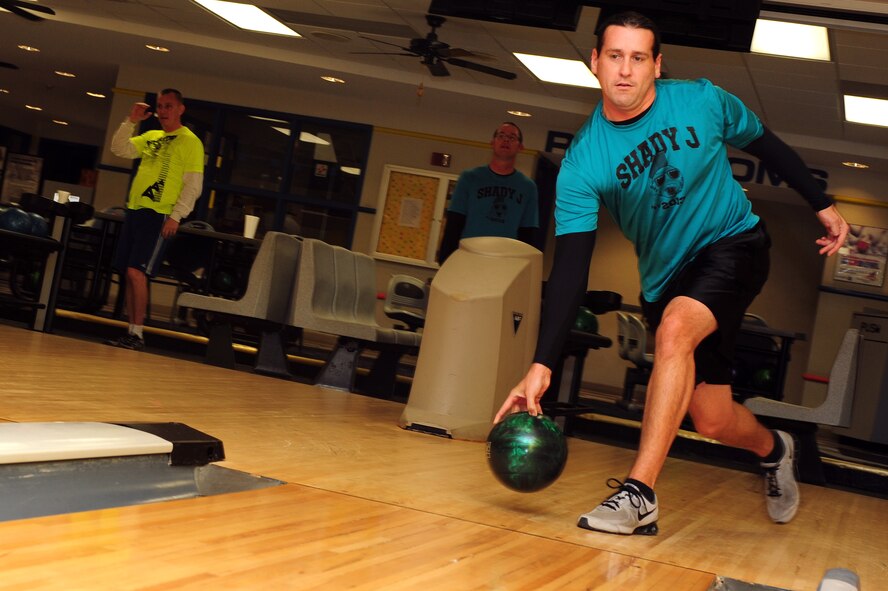 U.S. Air Force Master Sgt. Jeff Holden, 4th Component Maintenance Squadron precision measurement equipment laboratory section NCO in-charge, bowls during the Community Quest Game of Discovery at Seymour Johnson Air Force Base, N.C., Oct. 25, 2013. The community quest event mirrored “The Amazing Race,” and featured ten objectives with prizes for the top three finishing teams. (U.S. Air Force photo by Airman 1st Class John Nieves Camacho)