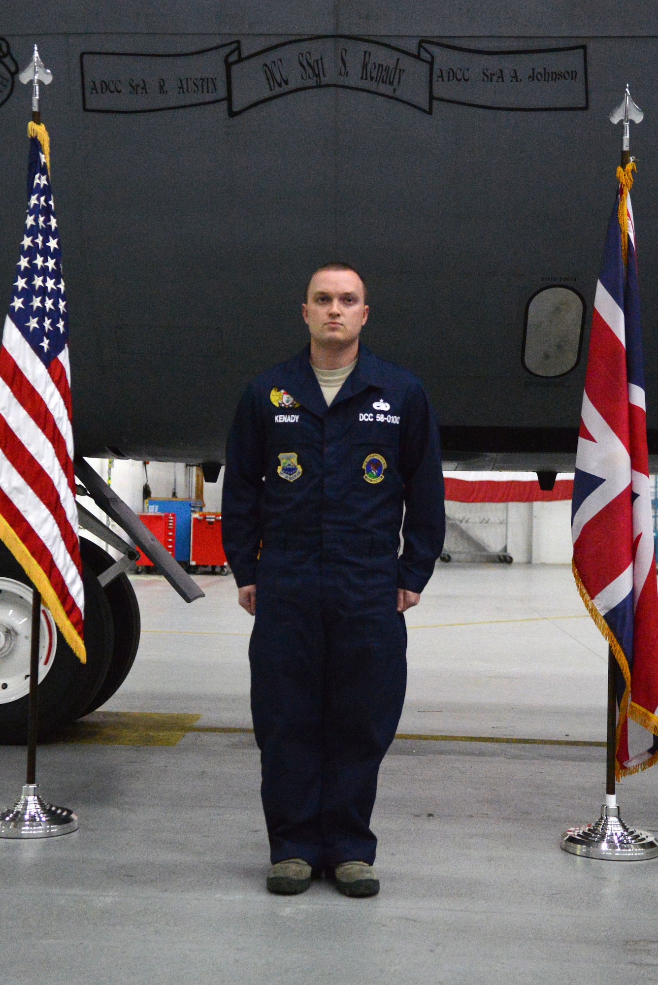 U.S. Air Force Staff Sgt. Scott Kenady, 100th Aircraft Maintenance Squadron dedicated crew chief from McKinney, Texas, stands at attention during a dedicated crew chief ceremony Oct. 30, 2013, on RAF Mildenhall, England. Kenady is recognized as the maintenance expert for his assigned aircraft, the KC-135 Stratotanker tail number 58-0100. The pilot of this aircraft is Col. Kenneth T. Bibb Jr., 100th Air Refueling Wing commander. (U.S. Air Force photo by Airman 1st Class Kyla Gifford/Released)