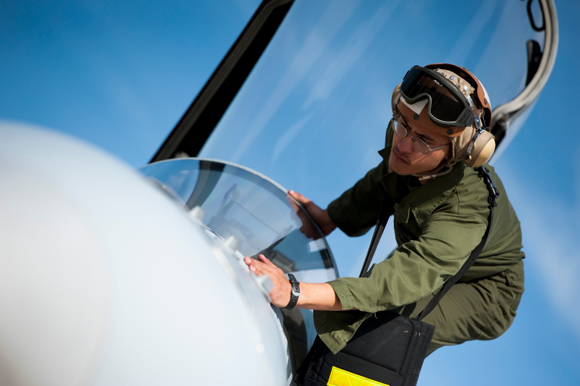 Cpl. Mathew Hough, Marine Fighter Attack Squadron 112 crew chief, inspects an F-18 Hornet after the jet completed a Max Thunder mission, at Kunsan Air Base, Republic of Korea, Oct. 30, 2013. Maintainers from the entire joint team worked day and night in order to maintain the schedule. This is the 11th Max Thunder exercise, which fosters bilateral aerial training between the Korea Air Power Team to include the U.S. Air Force, Marine Corps and the Republic of Korea air force. (U.S. Air Force photo by Senior Airman Armando A. Schwier-Morales)