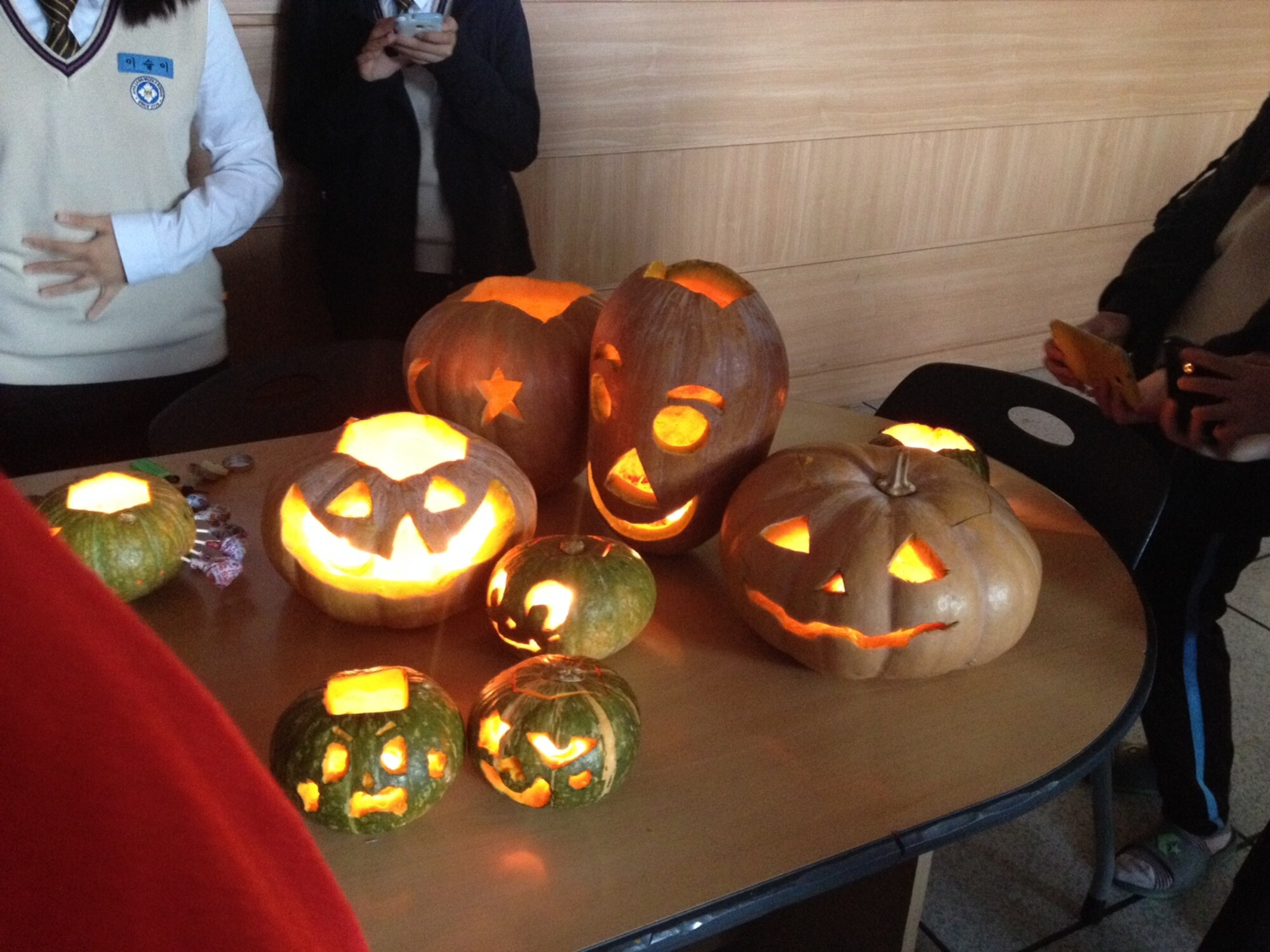 Pumpkins made by the Changdang Middle School students are seen glowing brightly during a visit by volunteers from Osan Air Base in Osan City, Republic of Korea, Oct. 25, 2013. Volunteers helped the students carve pumpkins and learning about the Halloween traditions. (U.S. Air Force photo/Capt. Tamara Fischer-Carter)