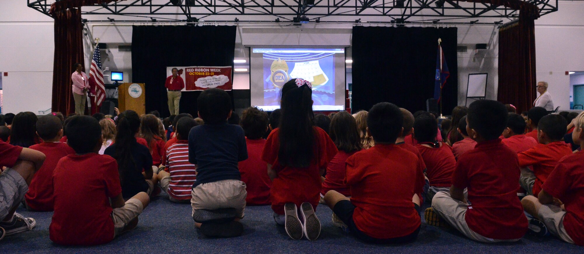 Students at Andersen Elementary School attend a Red Ribbon Week assembly Oct. 30, 2013, at Andersen Air Force Base, Guam. Red Ribbon Week is observed throughout the United States with its main objective being to present a unified commitment toward the creation of a drug-free America. (U.S. Air Force photo by Airman 1st Class Mariah Haddenham/Released)