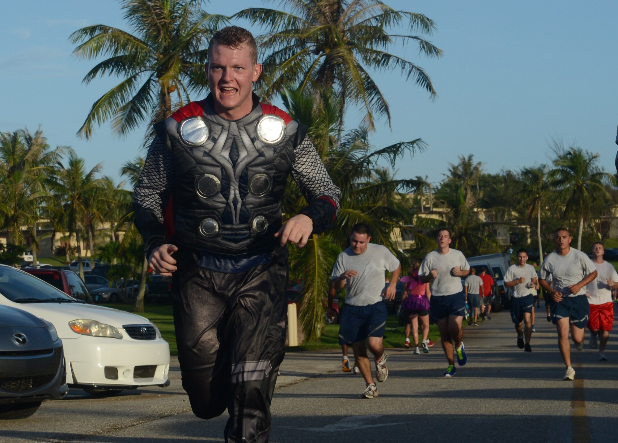 A Halloween Hustle 5K Fun Run and Walk participant dressed as the character Thor finishes the race Oct. 30, 2013, on Andersen Air Force Base, Guam. Approximately 350 people participated in the Halloween Hustle as part of the monthly 5K event conducted by Coral Reef Fitness Center Airmen. (U.S. Air Force Photo by Airman 1st Class Emily A. Bradley/Released)