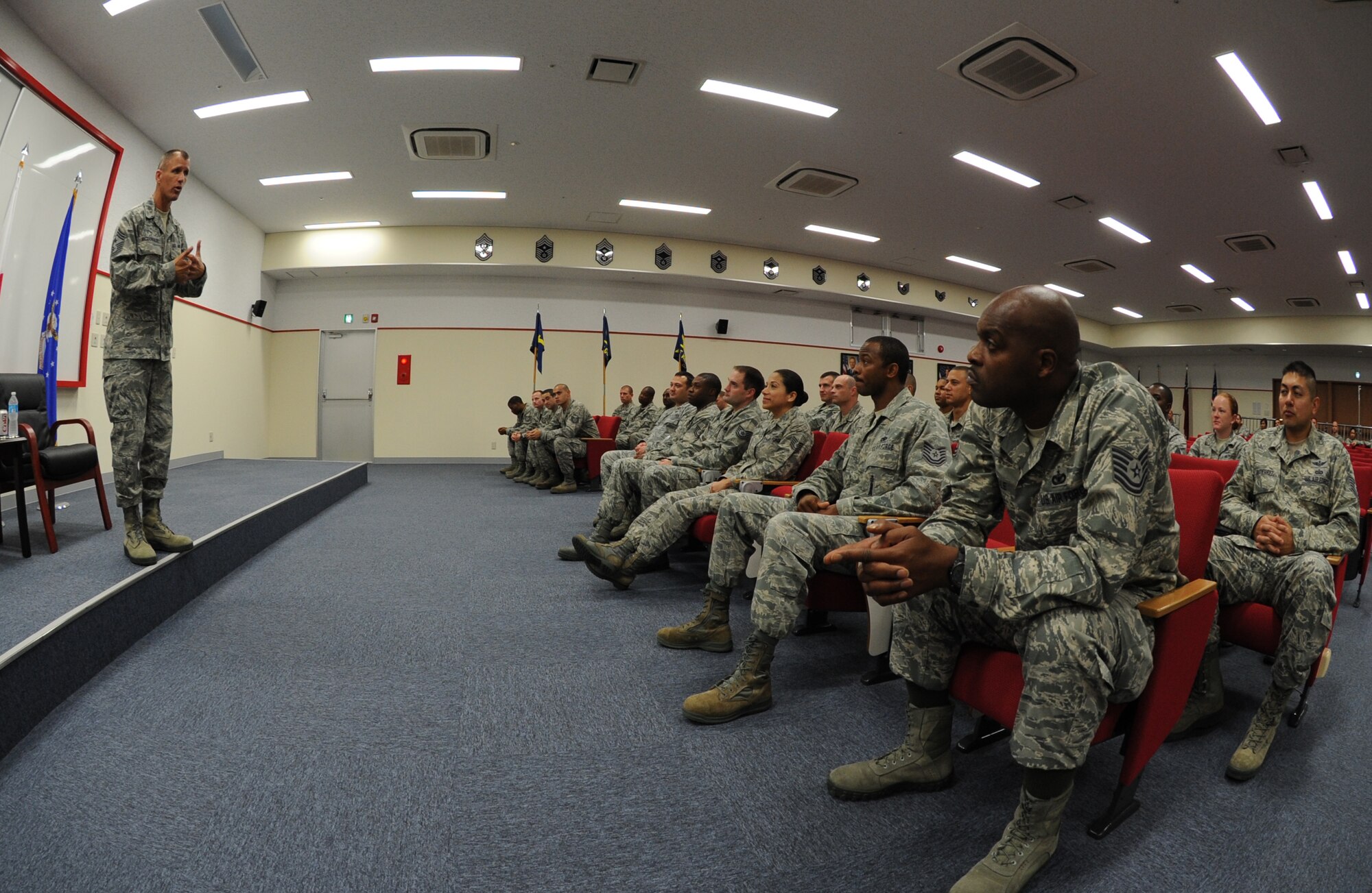 U.S. Air Force Chief Master Sgt. Steve McDonald, Pacific Air Forces command chief, speaks to NCOs going through the NCO Academy course at the Erwin Professional Military Education Center on Kadena Air Base, Japan, Oct. 28, 2013. During his visit to the PME center, McDonald learned more about the Airman Leader School and NCOA courses that enlisted members receive when transitioning to the NCO and senior NCO tiers. (U.S. Air Force photo by Airman 1st Class Keith James)