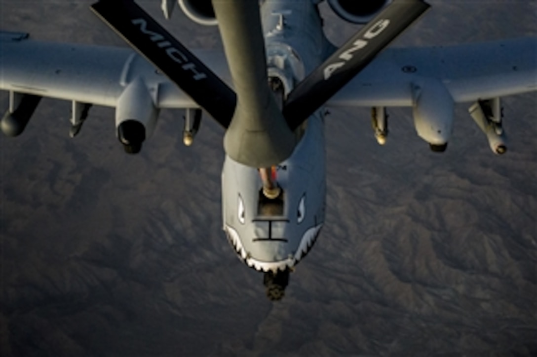 A U.S. Air Force A-10C Thunderbolt II receives fuel from a KC-135 Stratotanker during an in-flight refueling over Afghanistan on Oct. 2, 2013.  The Thunderbolt II is attached to the 74th Expeditionary Fighter Squadron in support of Operation Enduring Freedom. The Stratotanker is assigned to the 340th Expeditionary Air Refueling Squadron. 