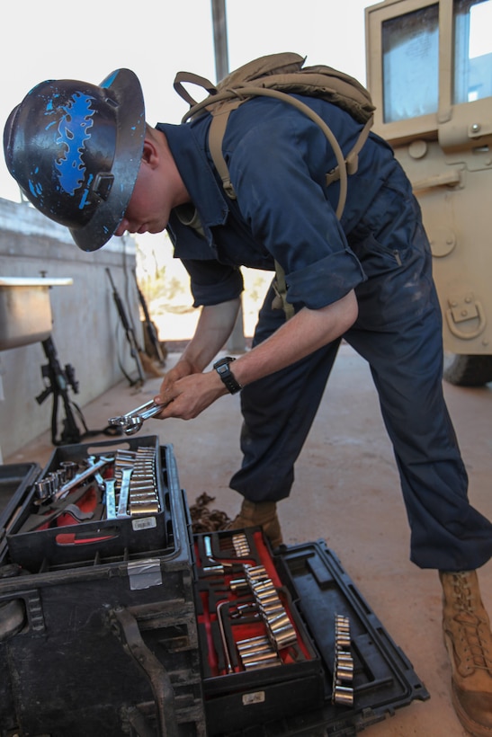 Lance Cpl. Chase J. Dusenbury, an 18-year-old motor transportation mechanic for Combat Logistics Battalion 31, 31st Marine Expeditionary Unit, and a native of Lexington, S.C., selects the correct socket wrench for a maintenance task here, Sept. 1. The Marines of CLB-31’s maintenance section are working long days and late nights to keep pace with the required maintenance that comes with supporting the battalion-sized element currently executing Exercise Koolendong 13. Koolendong is a week-long, live-fire exercise that demonstrates the operational reach of the 31st MEU. Also participating in the exercise is the Marine Rotational Force – Darwin and soldiers of the 5th Royal Australian Regiment. The 31st MEU brings what it needs to sustain itself to accomplish the mission or to pave the way for follow-on forces. The 31st MEU is the Marine Corps' force in readiness for the Asia-Pacific region and the only continuously forward-deployed MEU. 