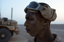 Lance Cpl. James McMorris, a Deerfield Beach, Fla., native and combat engineer with Combat Logistics Regiment 2, Regional Command (Southwest), takes a break from filling HESCO bearers at Camp Dwyer, Afghanistan, Aug. 11, 2013. McMorris spent hours helping to level off dirt inside the containers during infrastructure improvement projects at the base.