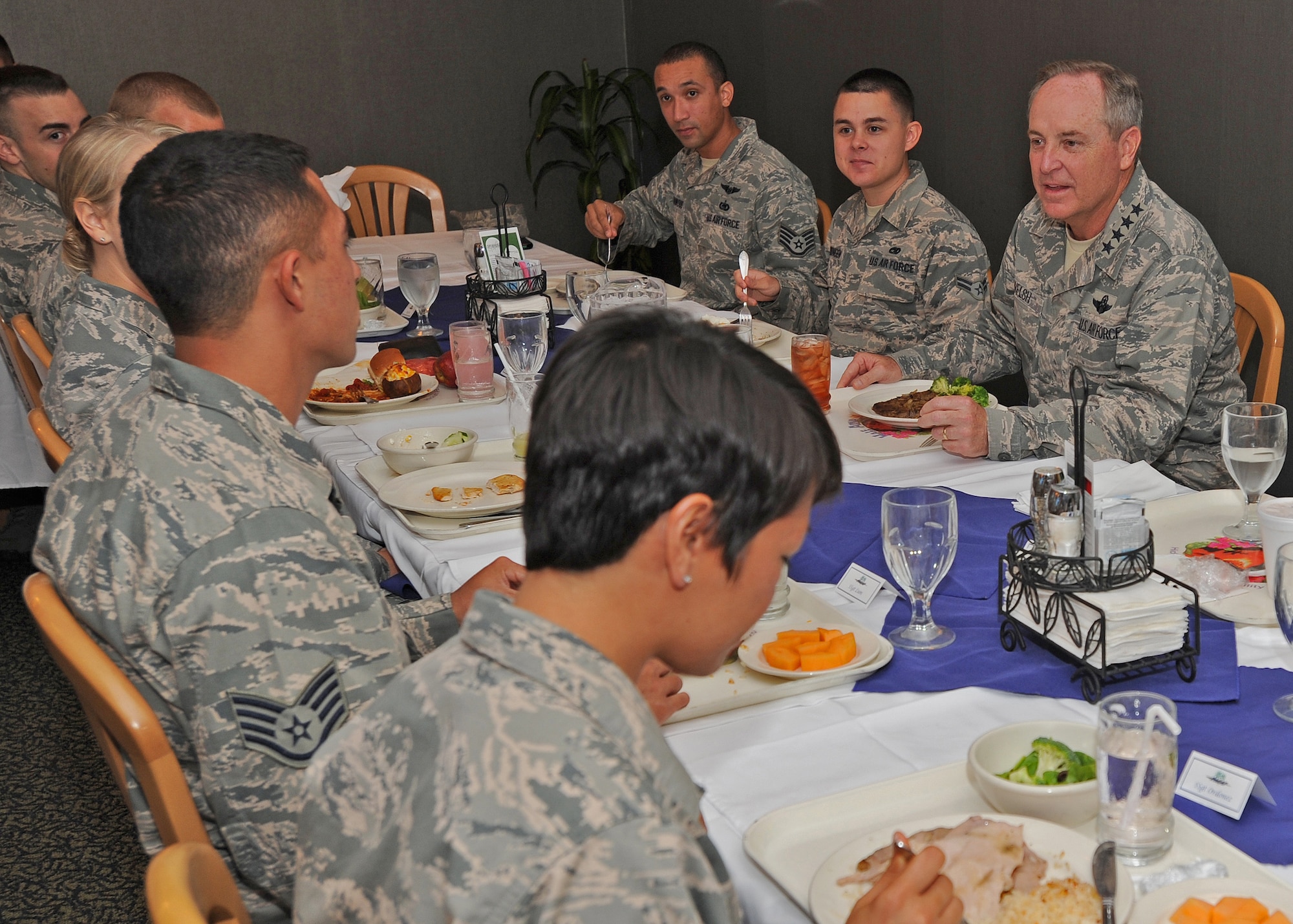 Air Force Chief of Staff Gen. Mark A. Welsh III shares lunch with Pacific Air Forces Airmen at the Hale Aina Dining Facility at Joint Base Pearl Harbor-Hickam, Hawaii, Aug. 19, 2013. As part of a three-day visit to Hawaii, Welsh thanked Airmen for their continued service and dedication and addressed issues concerning Airmen and their families. (U.S. Air Force photo/Tech. Sgt. Jerome S. Tayborn)
