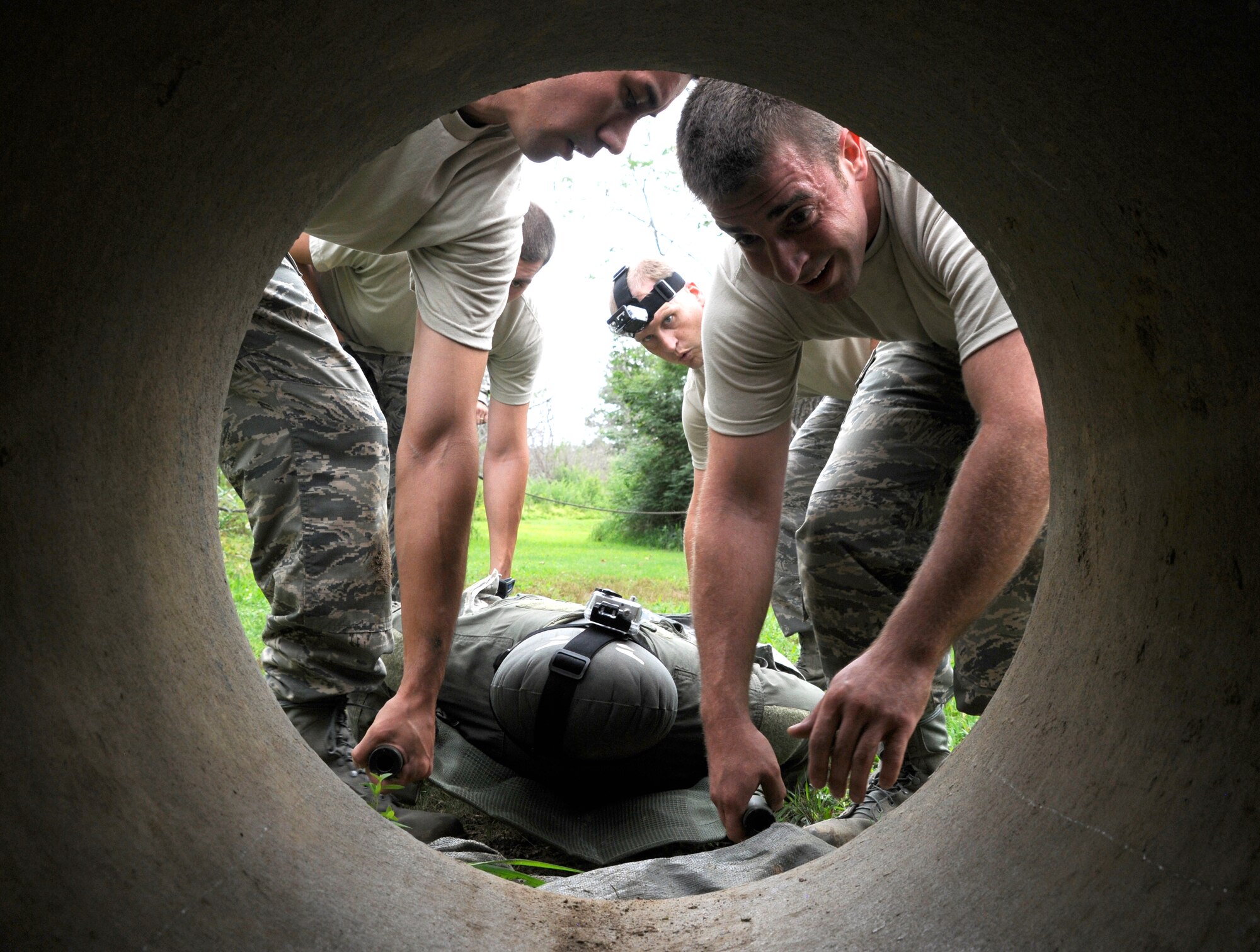 188th Security Forces Squadron Airmen prepare to move through a pipe obstacle at the Fort Chaffee Maneuver Training Center obstacle course, Aug. 3, 2013. (U.S. Air National Guard photo by Senior Airman Hannah Landeros/188th Fighter Wing Public Affairs)