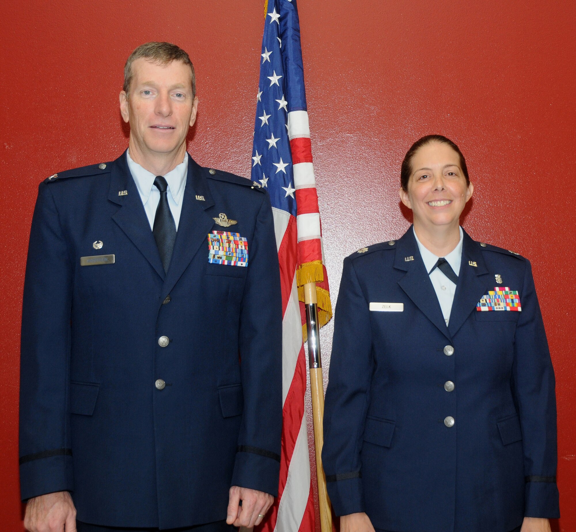 Col. Mark Anderson, 188th Fighter Wing commander, left, stands alongside new 188th Medical Group commander, Lt. Col. Misty Zelk, at the 188th Med Group’s change of command ceremony held during August’s unit training assembly. Col. Paul Norris relinquished command of the group to Zelk during the ceremony. (U.S. Air National Guard photo by Senior Airman John Hillier/188th Fighter Wing Public Affairs)