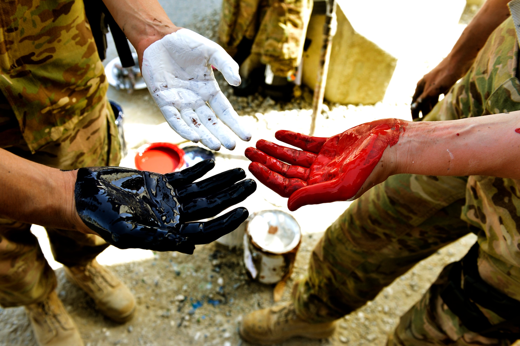 Three Airmen painted their interpretation of unity, respect, trust, strength and the will to protect on a wall leaving a visual legacy for those who follow in their footsteps to see here on Camp Cunningham Aug. 30, 2013. (U.S. Air Force photo/Staff Sgt. Stephenie Wade)