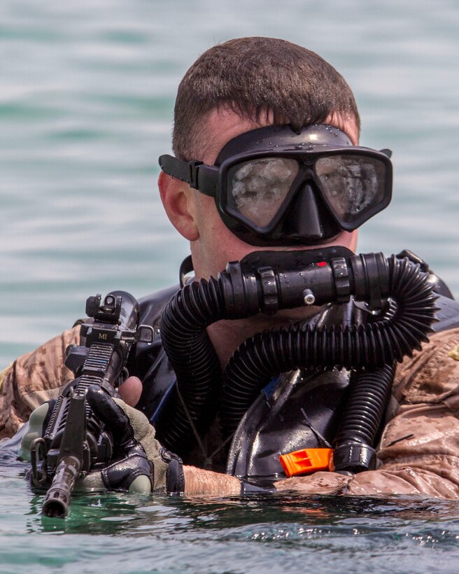 U.S. Marines assigned to Force Reconnaissance Platoon, Maritime Raid Force, 26th Marine Expeditionary Unit (MEU), provides security while conducting an amphibious insertion onto a beach while training foreign Marines in the U.S. 5th Fleet area of responsibility, Sept. 1, 2013. The 26th MEU is a Marine Air-Ground Task Force forward-deployed to the U.S. 5th Fleet area of responsibility aboard the Kearsarge Amphibious Ready Group serving as a sea-based, expeditionary crisis response force capable of conducting amphibious operations across the full range of military operations. (U.S. Marine Corps photo by Sgt. Christopher Q. Stone, 26th MEU Combat Camera/Released)