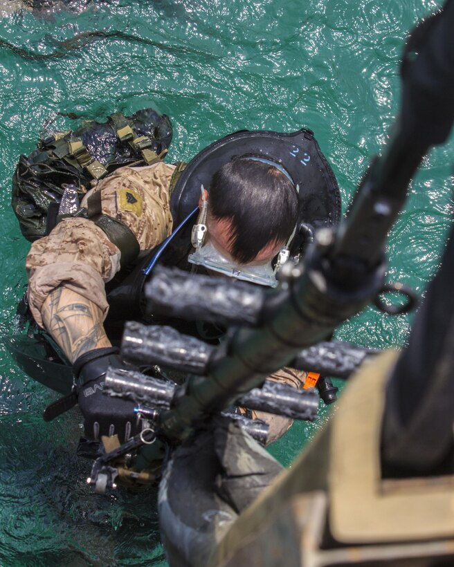 A U.S. Marine assigned to Force Reconnaissance Platoon, Maritime Raid Force, 26th Marine Expeditionary Unit (MEU), climbs a ladder as he conducts an amphibious insertion onto maritime infrastructure while training foreign Marines in the U.S. 5th Fleet area of responsibility, Sept. 1, 2013. The 26th MEU is a Marine Air-Ground Task Force forward-deployed to the U.S. 5th Fleet area of responsibility aboard the Kearsarge Amphibious Ready Group serving as a sea-based, expeditionary crisis response force capable of conducting amphibious operations across the full range of military operations. (U.S. Marine Corps photo by Sgt. Christopher Q. Stone, 26th MEU Combat Camera/Released)