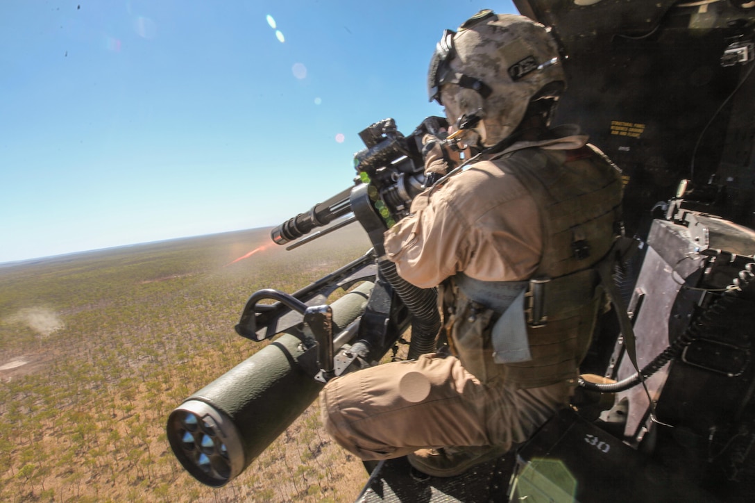 Sergeant Brian D. Richardson, a 29-year-old crew chief for Marine Medium Tiltrotor Squadron 265 (Reinforced), 31st Marine Expeditionary Unit, and a native of Leesburg, Fla., fires a 7.62mm GAU-17/A weapon system at enemy targets from a UH-1Y Venom helicopter during live-fire training as part of Exercise Koolendong 13 here, Sept. 2. Three Venom helicopters and four MV-22 Osprey aircraft are operating from an expeditionary airfield 300 miles inland, supporting the battalion-sized element conducting the exercise. Koolendong demonstrates the operational reach of the 31st MEU and why it is the force of choice for the Asia-Pacific region. Also participating in the exercise is the Marine Rotational Force – Darwin and soldiers of the 5th Royal Australian Army. The 31st MEU brings what it needs to sustain itself to accomplish the mission or to pave the way for follow-on forces. The size and composition of the 31st MEU makes it well suited for amphibious operations, which includes raids, assaults, evacuations and humanitarian assistance operations. 