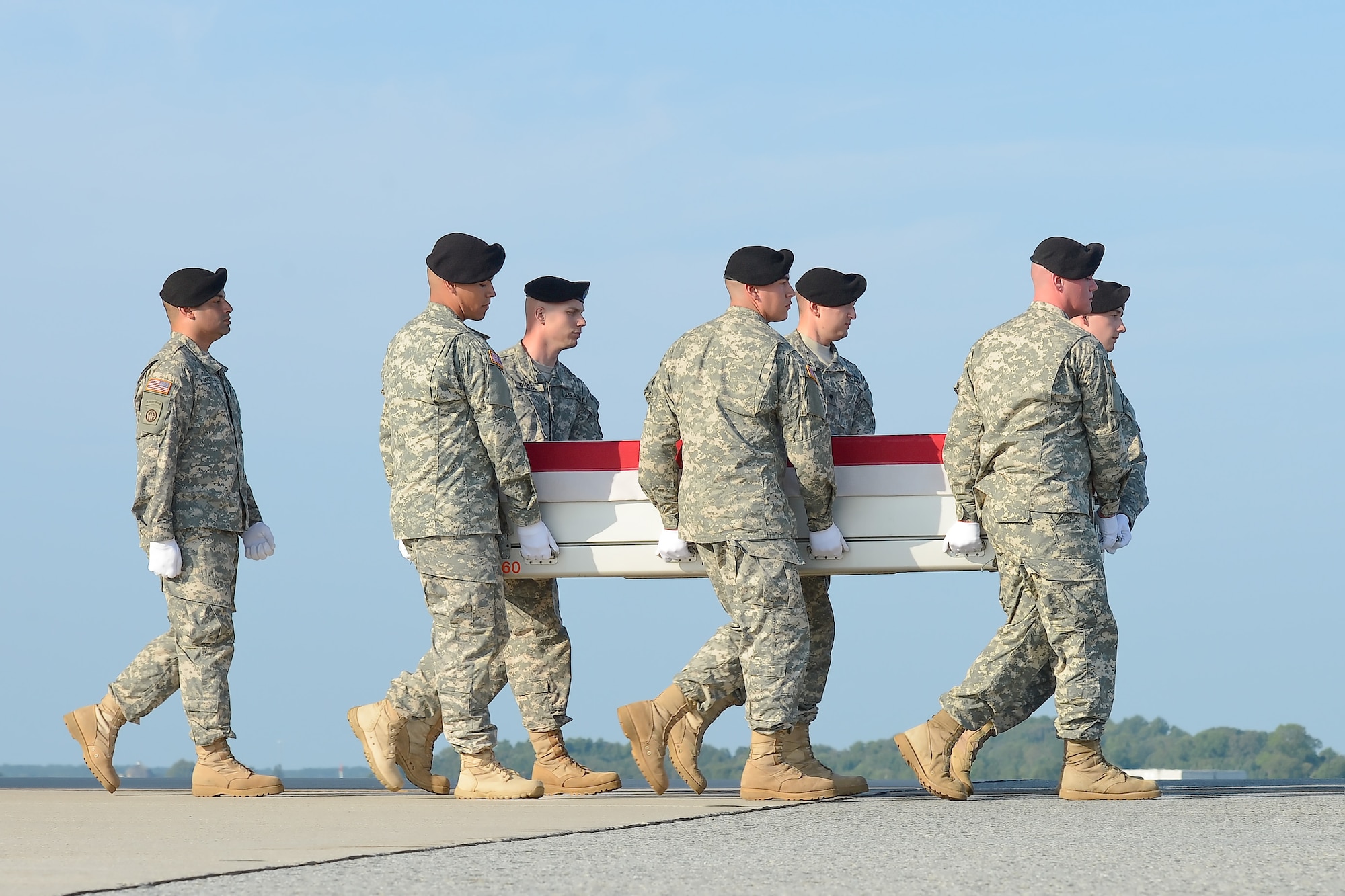 A U.S. Army carry team transfers the remains of Staff Sgt. Joshua J. Bowden, of Villa Rica, Ga., during a dignified transfer Sept. 2, 2013 at Dover Air Force Base, Del. Bowden was assigned to the 242nd Ordnance Battalion (EOD), 71st Ordnance Group (EOD), Fort Carson, Colo. (U.S. Air Force photo/Greg L. Davis)
