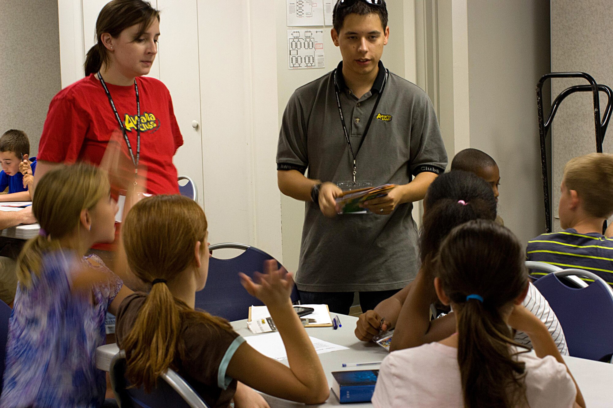 U.S. Air Force Staff Sgt. Christopher Shishido, 41st Electronic Combat Squadron, and Terra Shishido work with a group of kids in the Awana program at Davis-Monthan Air Force Base, Ariz., Sept. 5, 2012. The D-M Awana program has groups for kids ranging from preschool to high school. (Courtesy photo/Released)