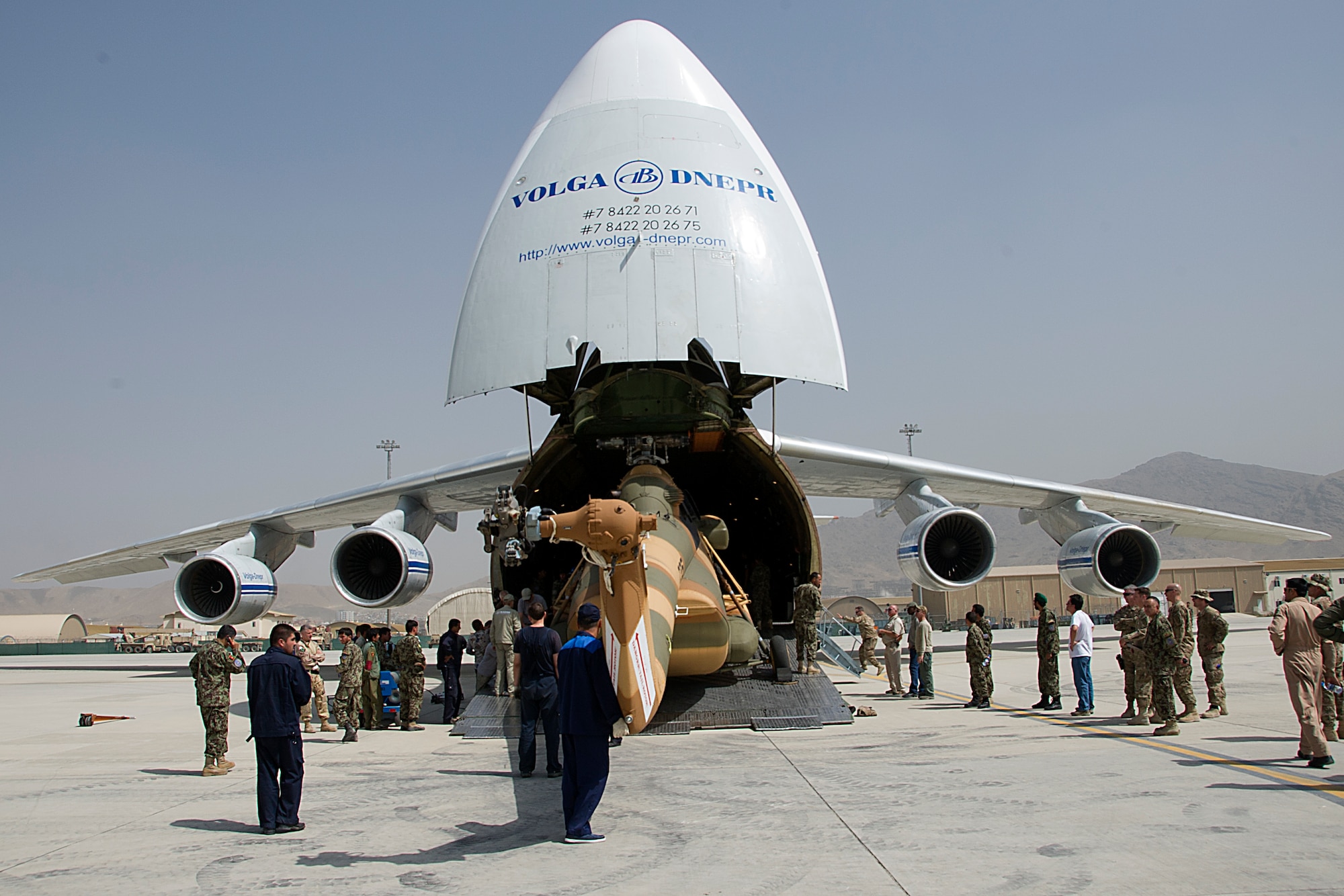 Afghan Air Force soldiers work together to move an Mi-17 out of a Russian Antonov An-124, Sept. 1 at Kabul International Airport Afghanistan. The helicopter is one of three new Mi-17's transported to KAIA, as part of Project 12 which will add 12 new helicopters to the Afghan Air Force. (U.S. Air Force Photo/RCAF Sgt. Robert Mellin)