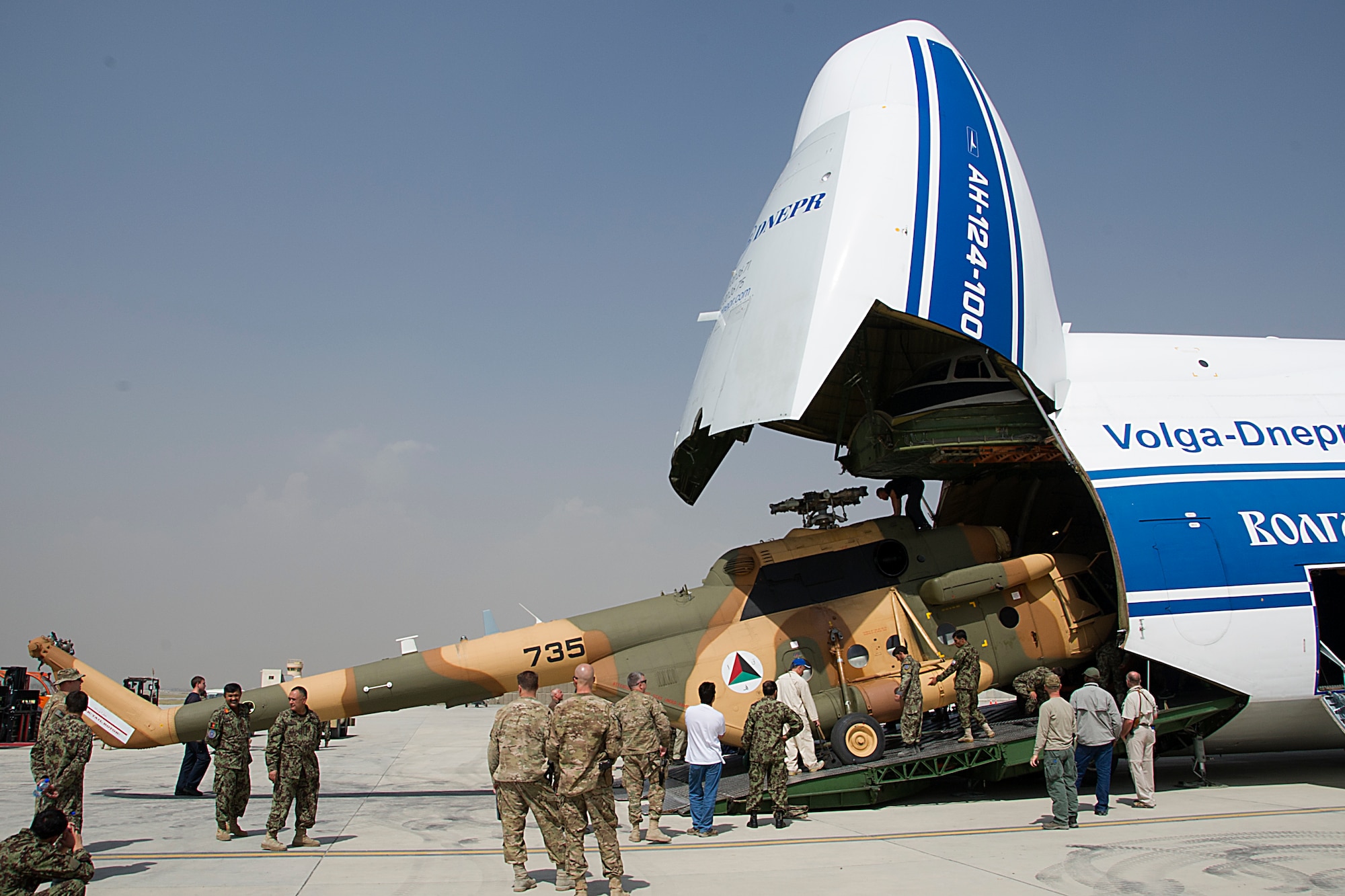 Afghan Air Force soldiers work together to move an Mi-17 out of a Russian Antonov An-124, Sept. 1 at Kabul International Airport Afghanistan. The helicopter is one of three new Mi-17's transported to KAIA, as part of Project 12 which will add 12 new helicopters to the Afghan Air Force. (U.S. Air Force Photo/RCAF Sgt. Robert Mellin)