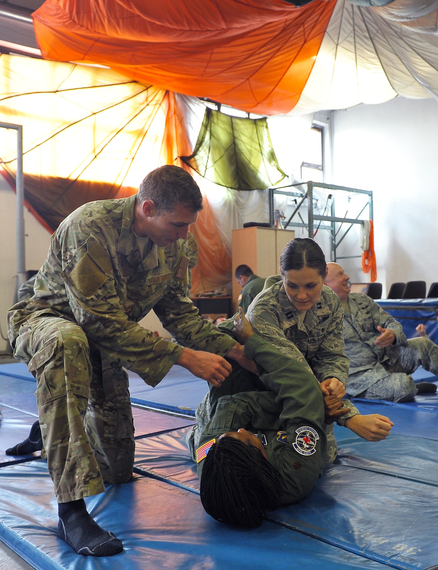 Staff Sgt. Josh Krape, 86th Operations Support Squadron survival, evasion, resistance, and escape specialist, teaches techniques during their survival, evasion, resistance and escape refresher course, Aug. 13, 2013, Ramstein Air Base, Germany. Aircrews are required to conduct SERE training every three years to stay current and in case they are stranded or lost in a downed aircraft. (U.S. Air Force photo/Airman Dymekre Allen)