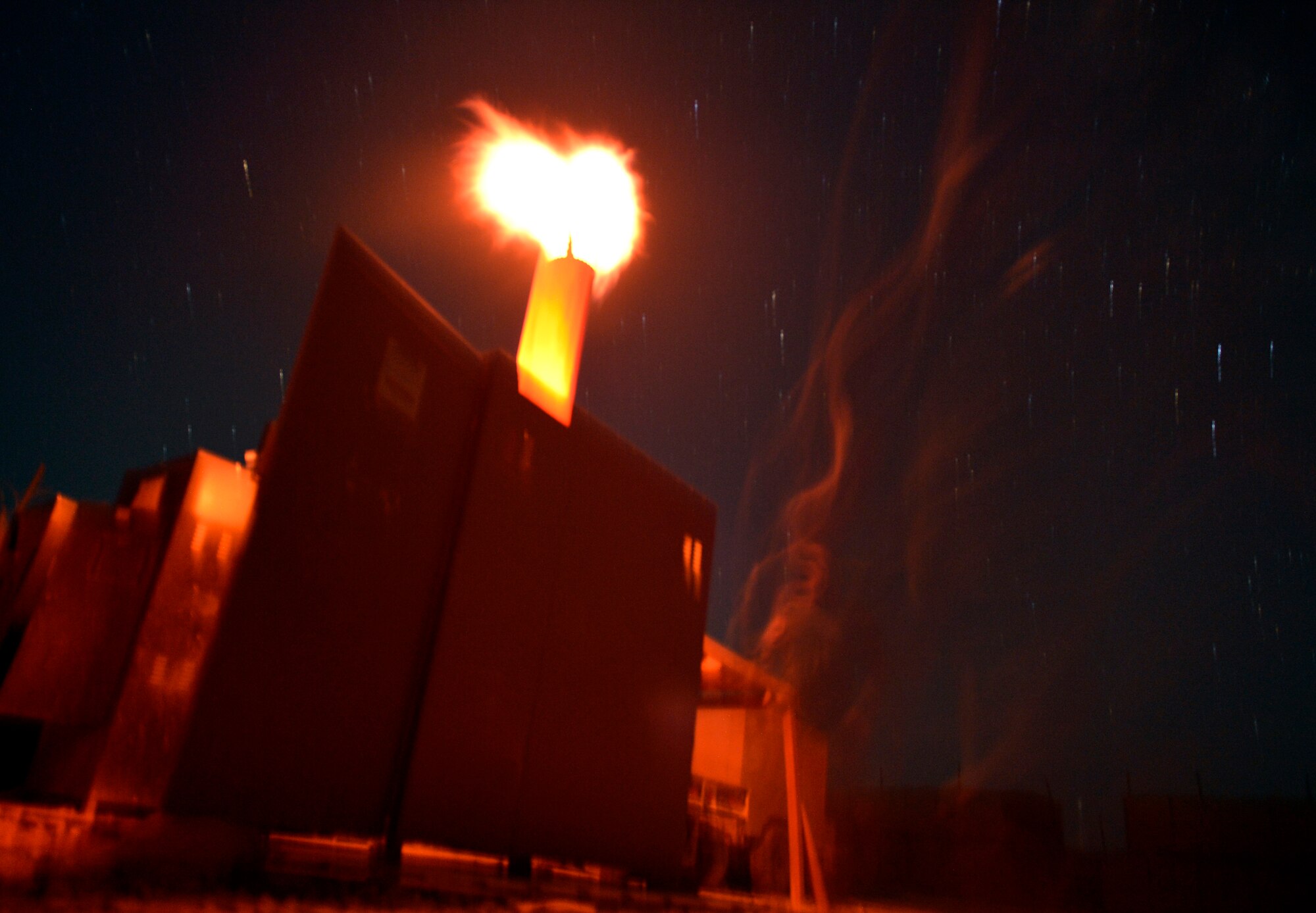 Staff Sgt. Chad Whitehead, checks on the progress of burning bio waste in an incinerator on Forward Operating Base Ghazni August 25, 2013. Whitehead is in charge of disposing of bio waste here. After its placed in the incinerator he has to check on it every forty-five minutes to ensure that the bio waste is being disposed of properly. Whitehead is a Forward Surgical Team emergency room technician and NCO in charge of Mortuary affairs here.  He is deployed from Keesler Air Force Base, Miss., and a native of Texarkana, Texas. (U.S. Air Force photo/ Staff Sgt. Stephenie Wade)