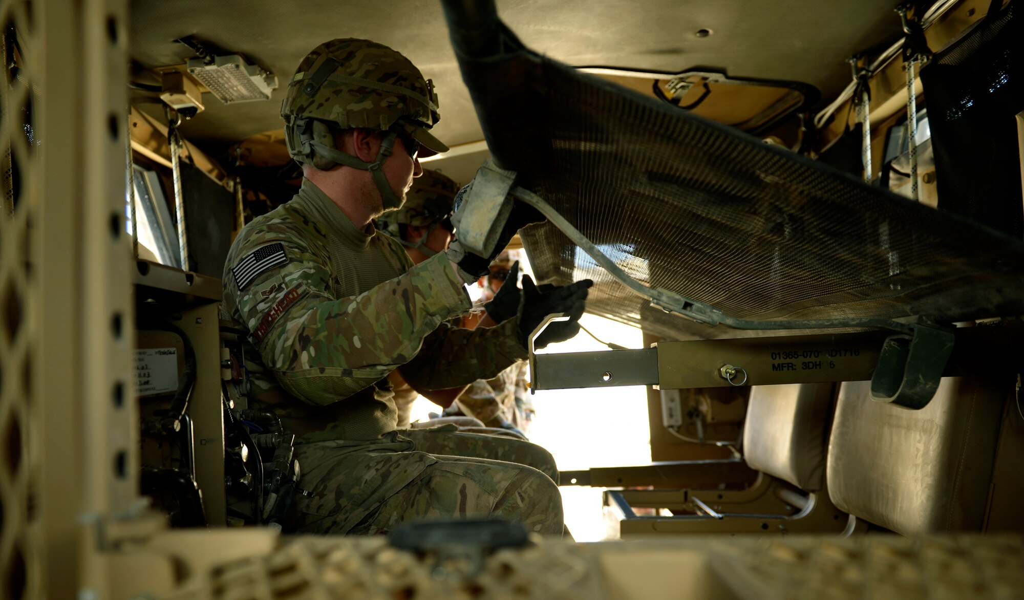 Medical technicians assigned to an all Air Force Forward Surgical Team on Forward Operating Base Ghazni, Afghanistan, practice lifting a simulate patient in and out of the teams new Mine-Resistant Ambush Protected vehicle that will replace their two current ambulances. The team is the only Air Force FST in Afghanistan. (U.S. Air Force photo/ Staff Sgt. Stephenie Wade)