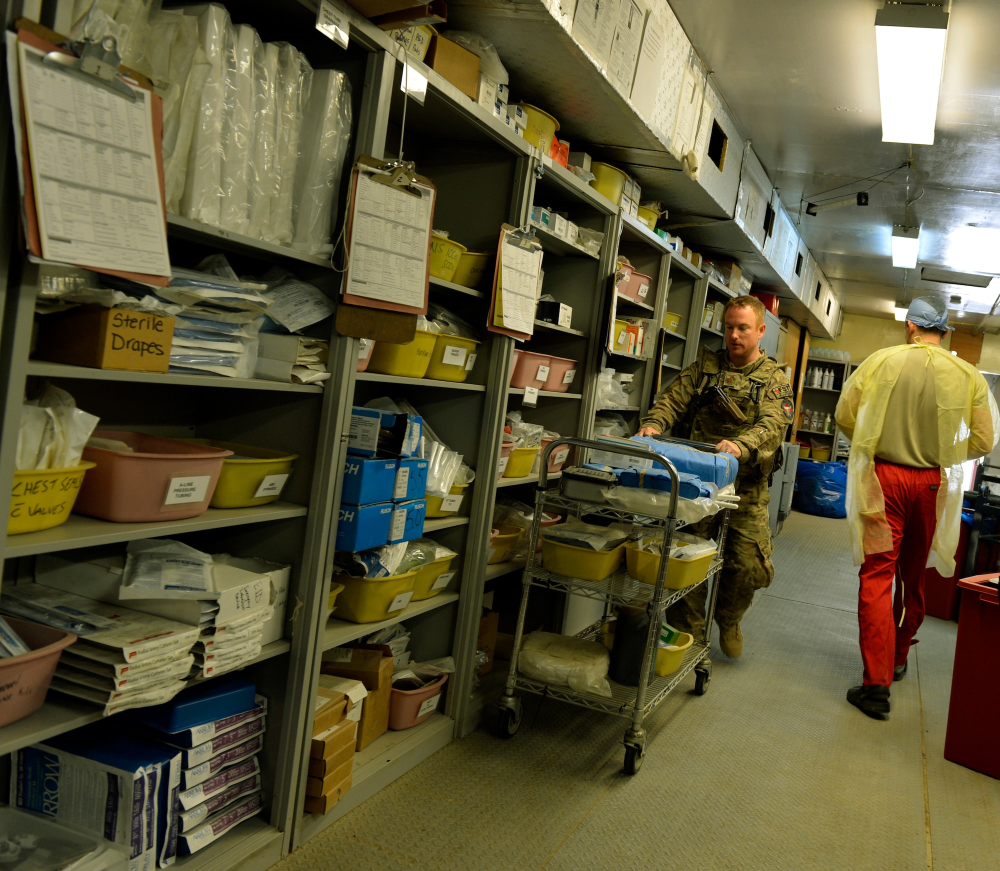 Maj. Jared Mort, Foward Surgical Team chief nurse, sets up the Emergency Room with supplies and equipment for an incoming patient on Forward Operating Base Ghazni, August 25, 2013. Mort is in charge of managing the nursing services to include triage, making schedules, ensuring equipment works and that everyone is in the right place at the right time to provide the best care that they can. He is deployed from Keesler Air Force Base, Miss. (U.S. Air Force photo/ Staff Sgt. Stephenie Wade)