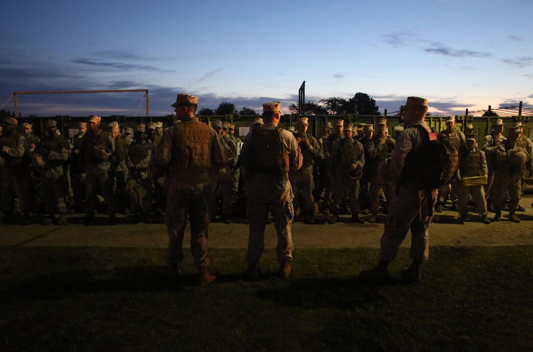 Marines and sailors attached to Combat Logistics Battalion 24, 2nd Marine Logistics Group stand in an accountability formation aboard Camp Allen, Va., prior to driving a convoy to Naval Amphibious Base Little Creek, Va., during a Defense Support of Civil Authorities, or DSCA, training exercise, Aug. 21, 2013. The service members conducted many of the operations, which would occur during a DSCA mission in the event of a natural disaster. 