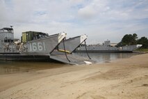A pair of Landing Craft Utilities belonging to the Navy’s Beach Departure Team 5 floats in the waters of Naval Amphibious Base Little Creek, Va., during a Defense Support of Civil Authorities, or DSCA, training exercise, Aug. 21, 2013. Marines and sailors with Combat Logistics Battalion 24, 2nd Marine Logistics Group performed operations simulating a DSCA mission in the event of a natural disaster.
