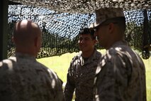 Cpl. Brian B. Babineau (center), a warehouse clerk with 2nd Supply Battalion, Combat Logistics Regiment 25, 2nd Marine Logistics Group speaks with students in the Ground Supply Officer Course at the Marine Corps’ Supply School during a cooperative field exercise aboard Camp Lejeune, N.C., Aug. 26, 2013. The operation gave students a chance to gain field experience and learn from Marines already serving in the Fleet Marine Force with a supply unit.