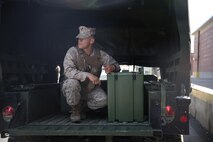 Lance Cpl. Andrew Galiano, a motor vehicle operator with 2nd Supply Battalion, Combat Logistics Regiment 25, 2nd Marine Logistics Group waits for a load of supplies destined for a cooperative field exercise held by the battalion and the Marine Corps’ Supply School aboard Camp Lejeune, N.C., Aug. 26, 2013. The battalion continued supply operations in support of II Marine Expeditionary Force while training Ground Supply Officer Course students from the Supply School. 