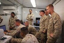 Students from the Ground Supply Officer Course at the Marine Corps’ Supply School learn about the role of supply in a field environment from Marines with 2nd Supply Battalion, Combat Logistics Regiment 25, 2nd Marine Logistics Group during a cooperative field exercise aboard Camp Lejeune, N.C., Aug. 27, 2013. Service members with the battalion gave students a hands-on experience with the tools of the trade and what to expect during a field operation with a supply unit.