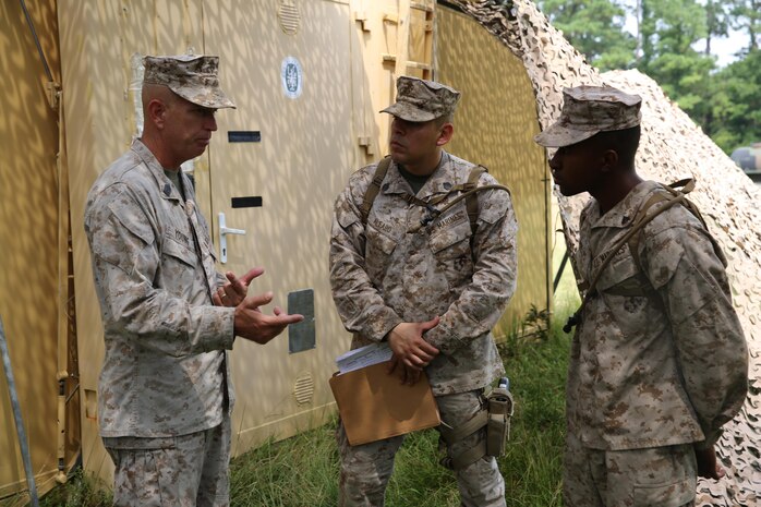 Sgt. Maj. George W. Young, the sergeant major of 2nd Marine Logistics Group, speaks to Marines with 2nd Supply Battalion, Combat Logistics Regiment 25, 2nd MLG about the responsibilities and tasks of the battalion during a cooperative field exercise between the unit and ground supply officer students from the Marine Corps’ Supply School aboard Camp Lejeune, N.C., Aug. 27, 2013. The operation put Marines with the battalion in the role of instructor for students during the five-day field exercise.