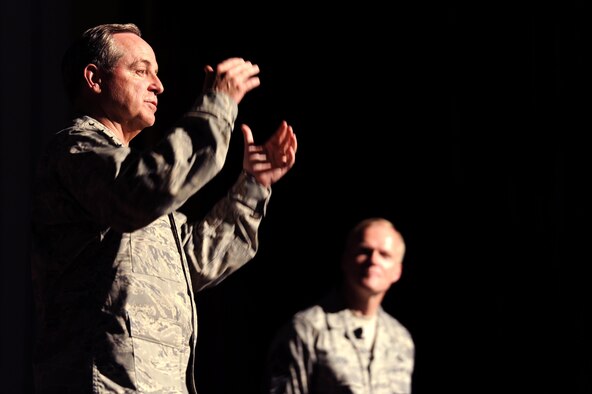 Air Force Chief of Staff Gen. Mark A. Welsh III talks to 18th Wing Airmen and Chief Master Sgt. of the Air Force James Cody listens during an Airman’s call on Kadena Air Base, Japan, Aug. 21, 2013. During their visit to Kadena, Welsh and Cody visited several units around the base and hosted an Airman’s call with 18th Wing Airmen, where they awarded five Distinguished Flying Crosses with valor. Welsh and Cody visited Kadena as part of a two-week visit to the region to thank Airmen and their families and discuss challenges and opportunities in the Pacific. (U.S. Air Force photo by Senior Airman Maeson L. Elleman)