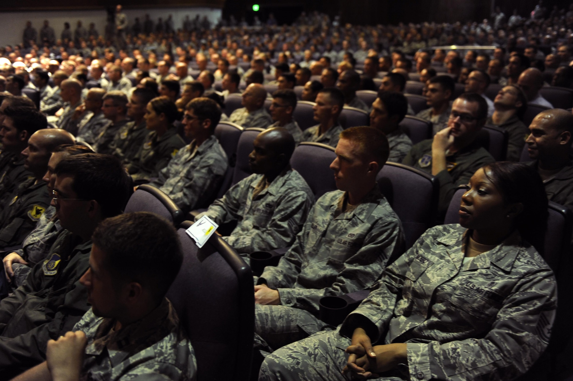 Airmen listen to Air Force Chief of Staff Gen. Mark A. Welsh III and Chief Master Sgt. of the Air Force James Cody during their visit to the 18th Wing, Aug. 21, 2013, at Kadena Air Base, Japan. During their visit, Welsh and Cody visited several units around the base and hosted an Airman’s call with 18th Wing Airmen, where they awarded five Distinguished Flying Crosses with valor. Welsh and Cody visited Kadena as part of a two-week visit to the region to thank Airmen and their families and discuss challenges and opportunities in the Pacific. (U.S. Air Force photo/Senior Airman Maeson L. Elleman)