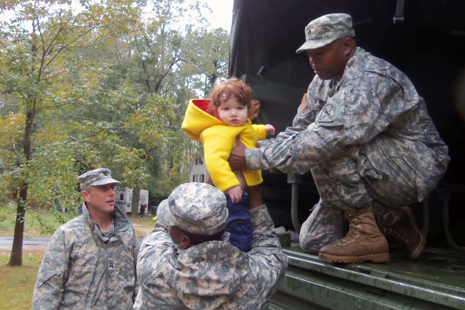 Virginia National Guard members rescued a child and several other flood victims Wednesday.