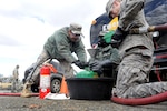 Soldiers and Airmen with the New York National Guard distribute fuel at the Staten Island Armory, Staten Island, N.Y., Saturday, Nov. 3, 2012, to those in the local area affected by Hurricane Sandy. The fuel was provided by the Federal Emergency Management Agency and distributed at various armories throughout the New York and northern New Jersey areas.