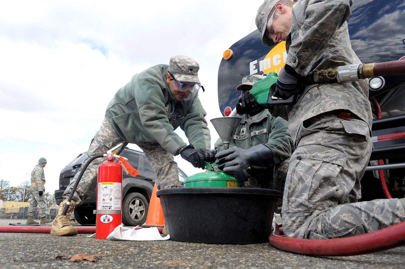 Soldiers and Airmen with the New York National Guard distribute fuel at the Staten Island Armory, Staten Island, N.Y., Saturday, Nov. 3, 2012, to those in the local area affected by Hurricane Sandy. The fuel was provided by the Federal Emergency Management Agency and distributed at various armories throughout the New York and northern New Jersey areas.