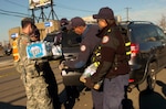 New York Army National Guardsmen distribute food, water and other supplies to civilians in need in the aftermath of Hurricane Sandy. New York Gov. Andrew Cuomo has mobilized more than 2,800 service members of New York's volunteer military forces to help civilian authorities in recovery efforts in the aftermath of Hurricane Sandy.