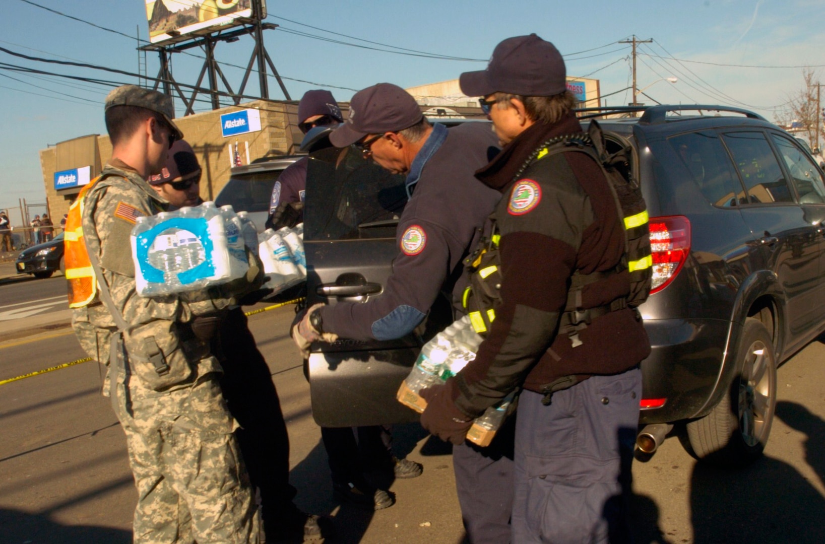 New York Army National Guardsmen distribute food, water and other supplies to civilians in need in the aftermath of Hurricane Sandy. New York Gov. Andrew Cuomo has mobilized more than 2,800 service members of New York's volunteer military forces to help civilian authorities in recovery efforts in the aftermath of Hurricane Sandy.