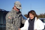 Army Chaplain (Maj.) Alex Knowles comforts a resident affected by Hurricane Sandy in the New York area. Chaplains have been in the areas affected by the storm providing support to both service members taking part in operations and those affected by the storm.