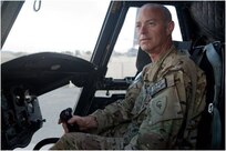 U.S. Army Chief Warrant Officer 2 Blaine Wyckoff, B Company, 3-238th, sits in the pilot's seat of a CH-47 Chinook helicopter at Forward Operating Base Salerno, Afghanistan, Oct. 20, 2012.