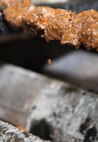 Beef Kabobs drip over a traditional grill at Naan and Kabob, Aug. 14. Naan and Kabob serves kabobs seasoned with traditional spices that Marines who have been deployed to Afghanistan may remember. 