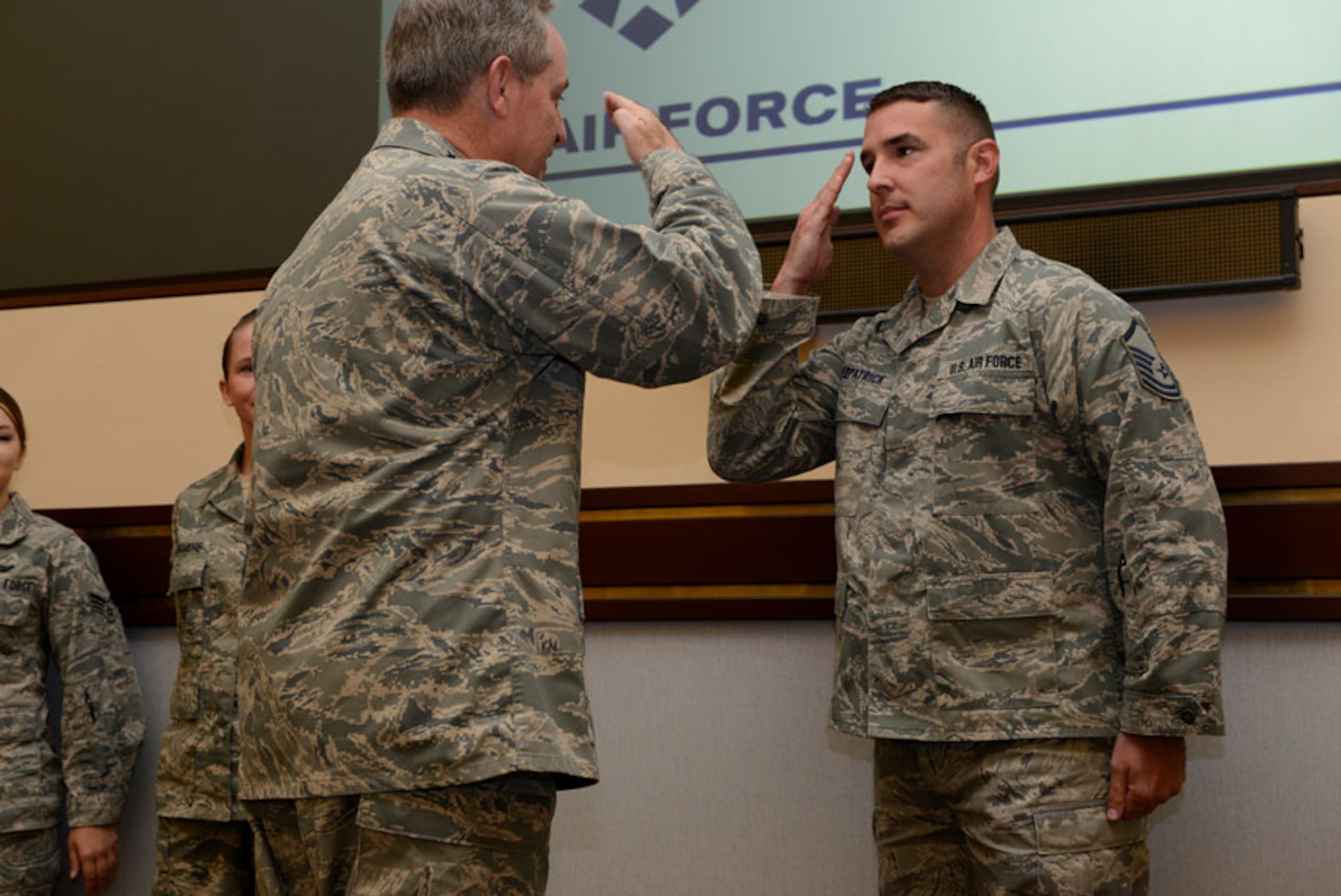 Air Force Chief of Staff Gen. Mark A. Welsh III recognizes Master Sgt. Scott E. Fitzpatrick as an outstanding performer Aug. 29, 2013, during a visit to Joint Base Elmendorf-Richardson. Fitzpatrick is the chief of mission support flight for the 611th Air Support Squadron. (U.S. Air Force photo/Airman First Class Omari Bernard) 