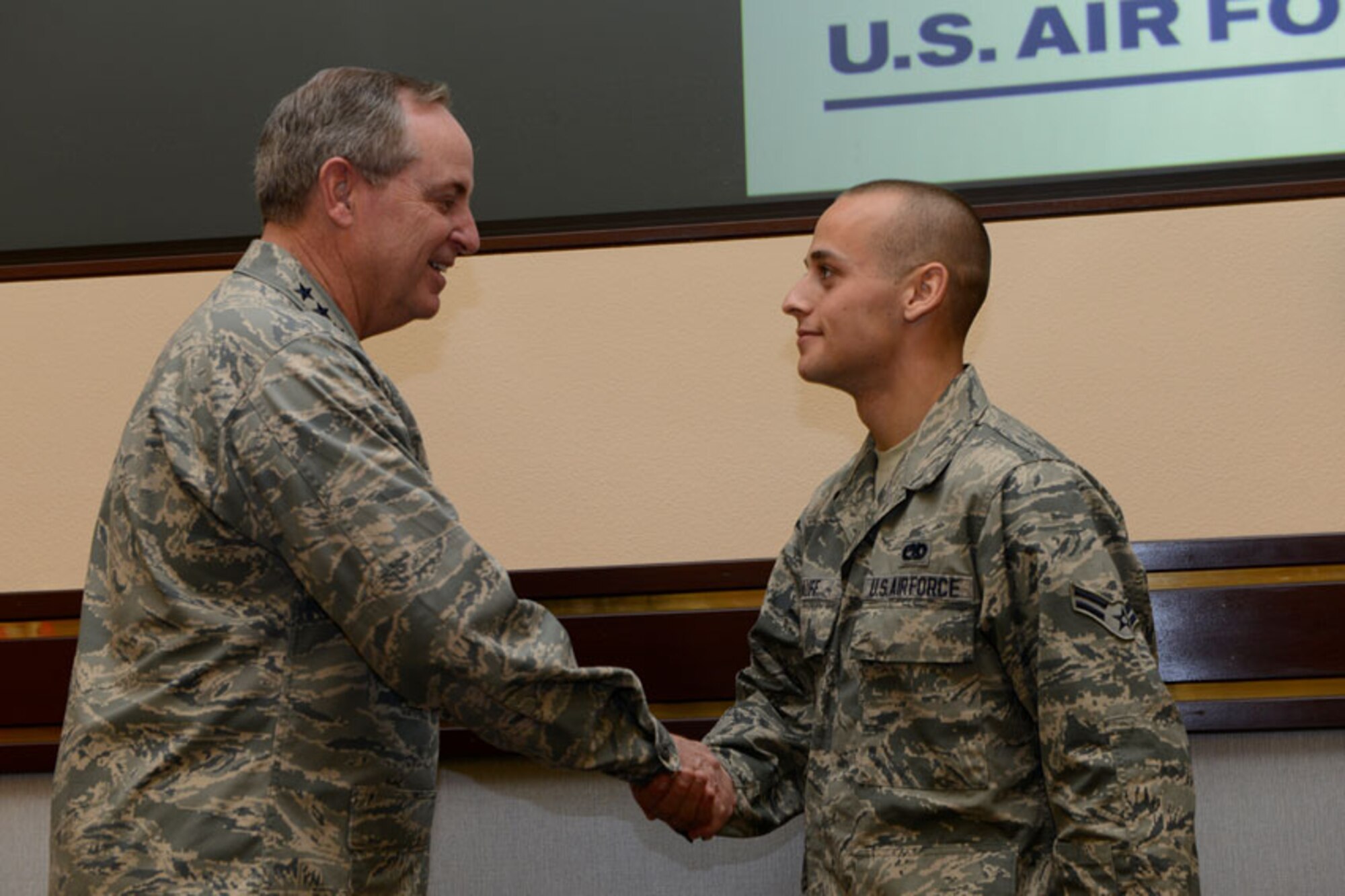 Air Force Chief of Staff, Gen. Mark A. Welsh III recognizes Airman 1st Class Robert Ruff as an outstanding performer Aug. 29, 2013 at Joint Base Elmendorf-Richardson. Ruff is an assistant dedicated crew chief with the 3rd Aircraft Maintenance Squadron. (U.S. Air Force photo/Airman First Class Omari Bernard) 