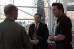 From left, Col. Edward Black, Dr. Don Erbschloe and Dr. Adam Steltzner of NASA share ideas Nov. 6, 2012, at the AATTC in St. Joseph, Mo. Steltzner joined with Air Mobility experts from across the Air Force to consider problems in airdrops.